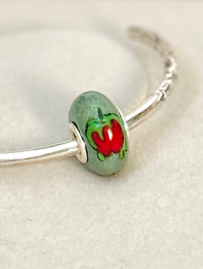 Charm manzana envenenada