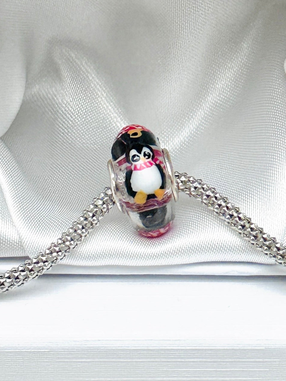 Charm Pingüinos y esferas