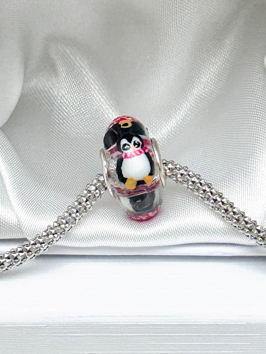 Charm Pingüinos y esferas