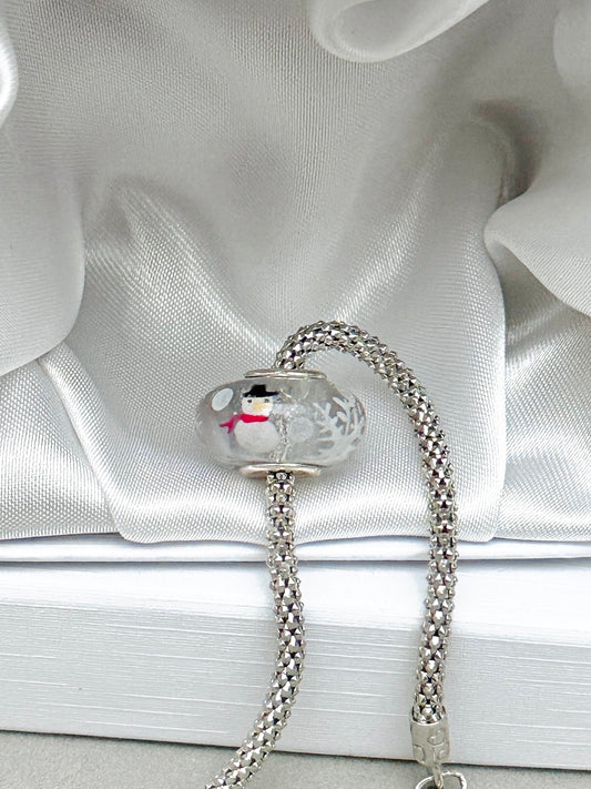 Charm muñeco de nieve y copos